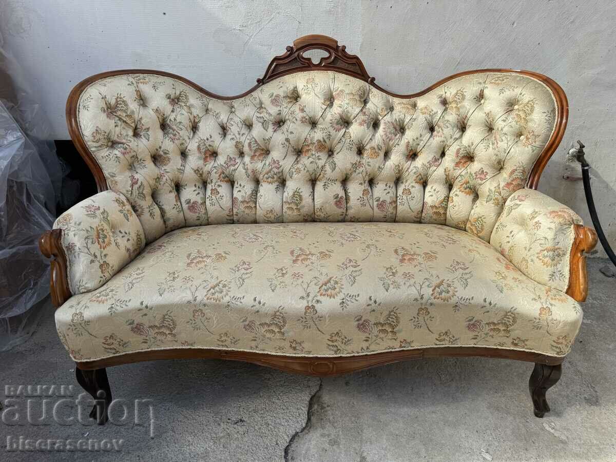 Vintage solid sofa with wood carving