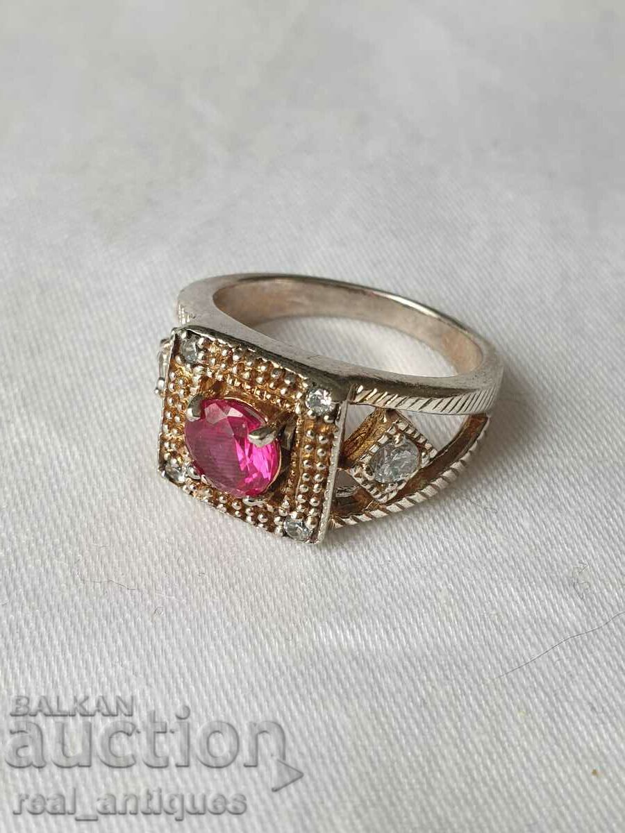 Silver ring with a ruby