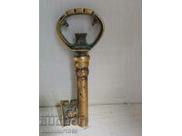 Old, bronze corkscrew for wine