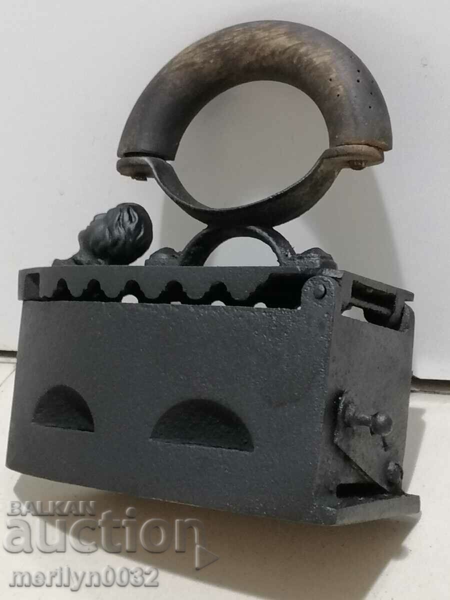 Auction  An old iron on fire