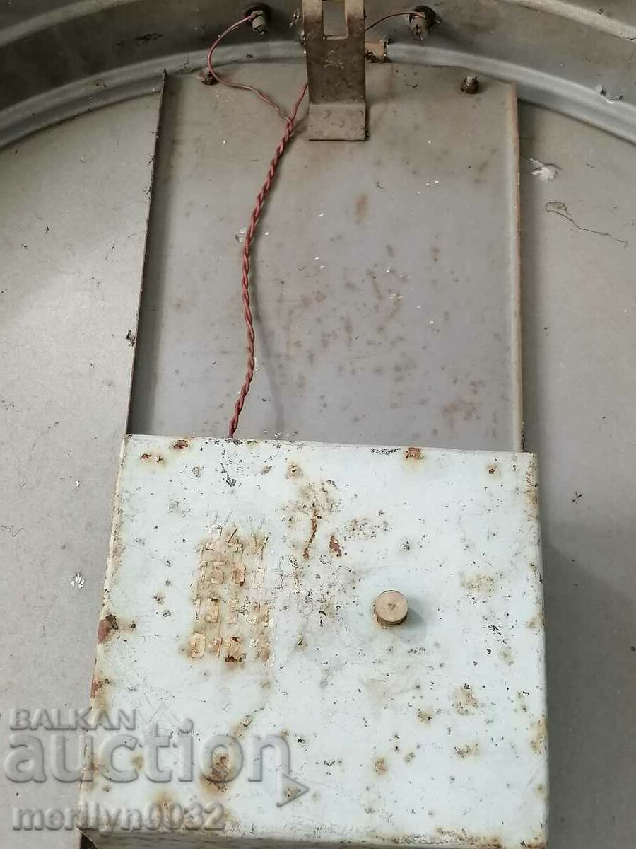 An old electric wall clock from the social work plant NRB - 5