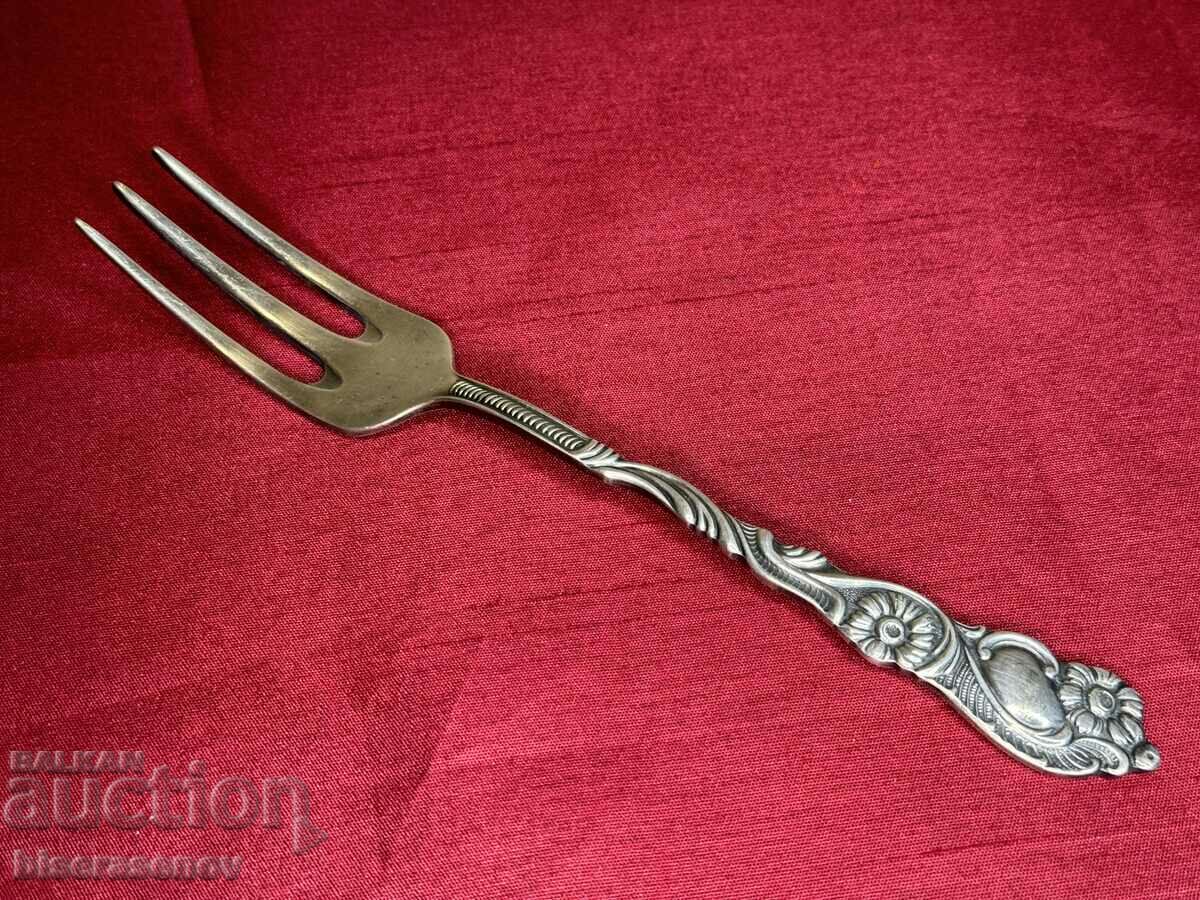 Silver-plated embossed fork marked EXTRA PRIMA NS.ALP.