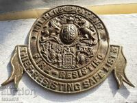 O emblemă grozavă veche a stației de pompieri engleze din bronz