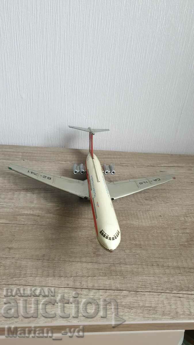 Delivery of Old social tin toy Soviet IL-62 aircraft Delivery of Old social tin toy Soviet IL-62 aircraft