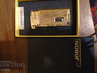 branded deluxe pipe lighter, maybe gold plated?