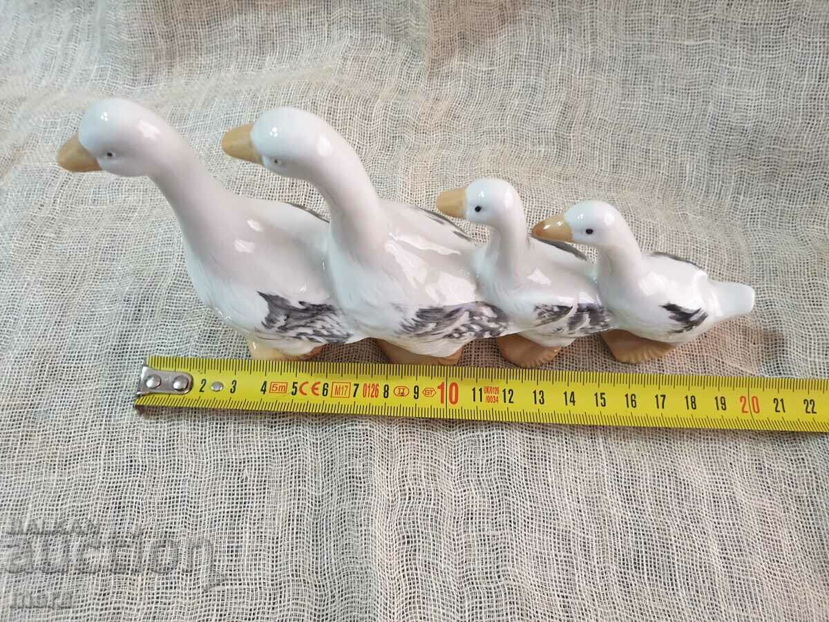 Delivery of A beautiful porcelain figurine of a family of ducks Delivery of A beautiful porcelain figurine of a family of ducks