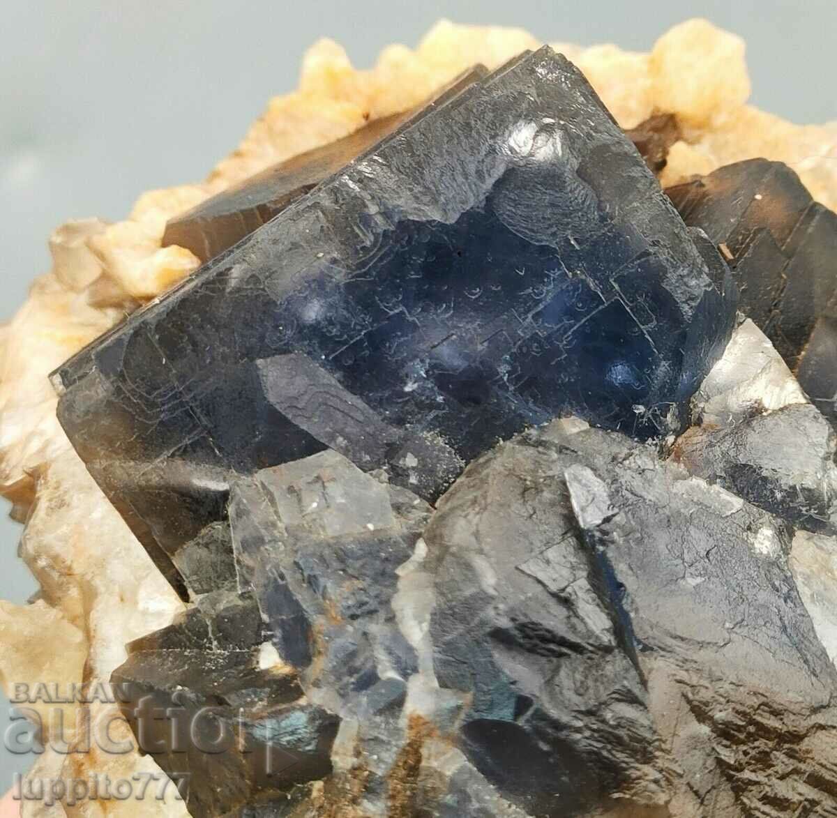 215 grams of natural blue fluorite with calcite on a unique matrix