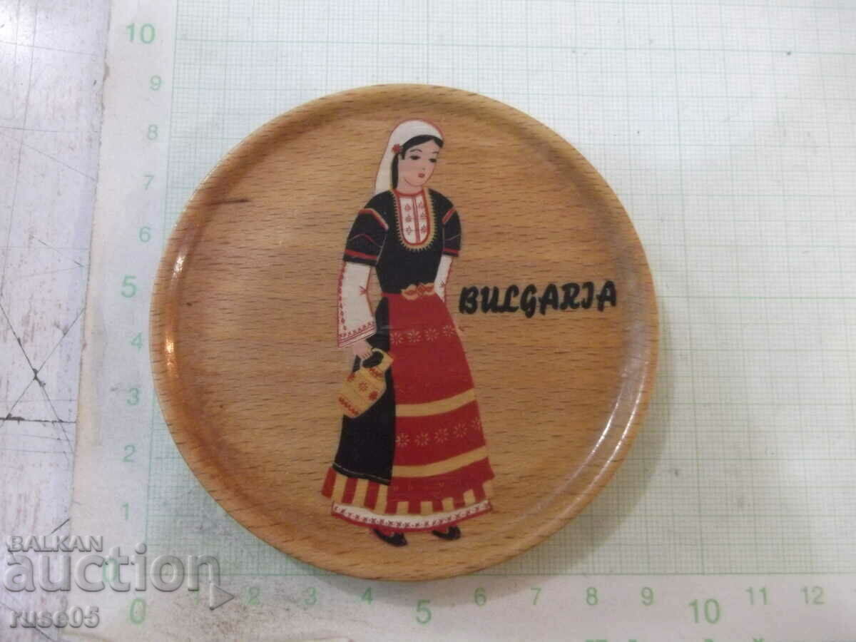 A wooden plate from Sotsa with a painted girl in Bulgarian. costume with price 4.00 BGN | € 2.05