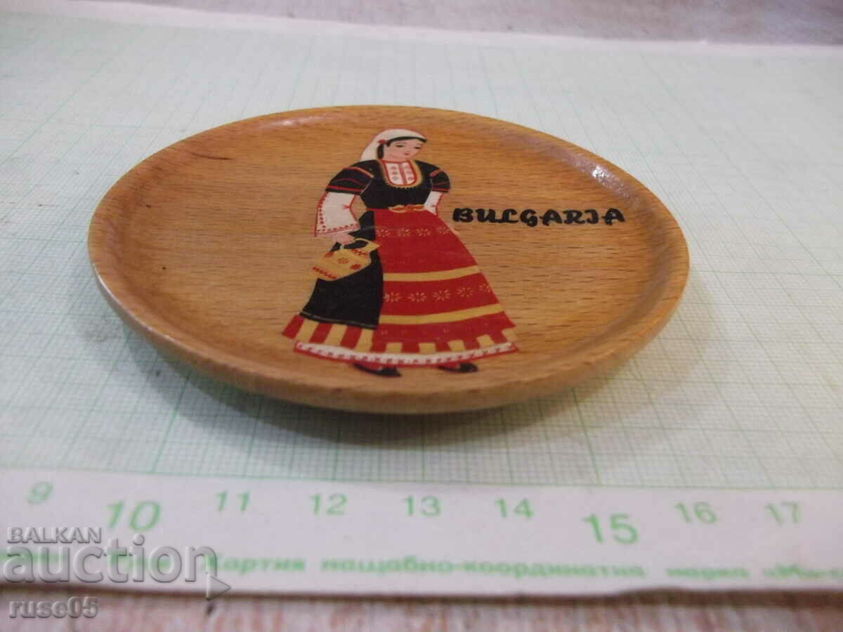 Auction  A wooden plate from Sotsa with a painted girl in Bulgarian. costume