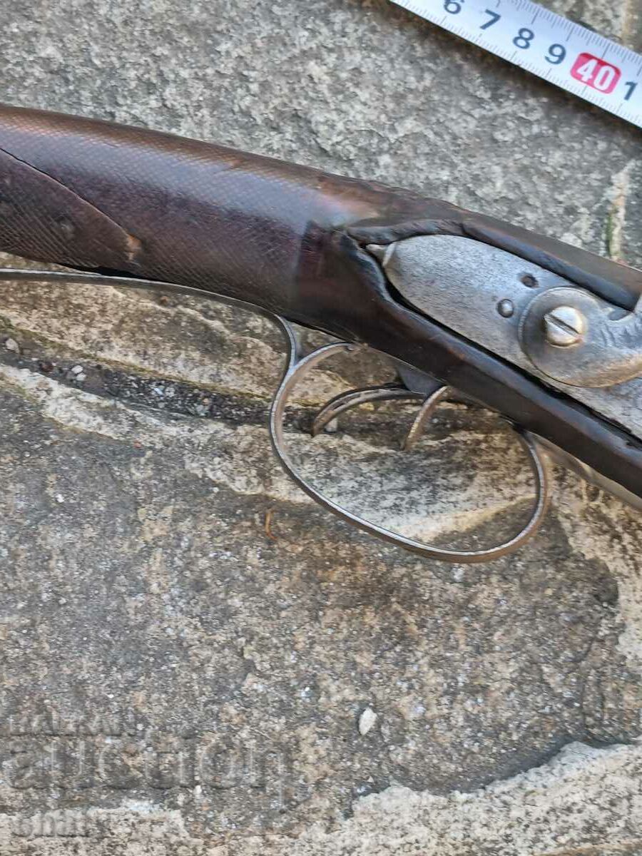 Auction  An old rifle.