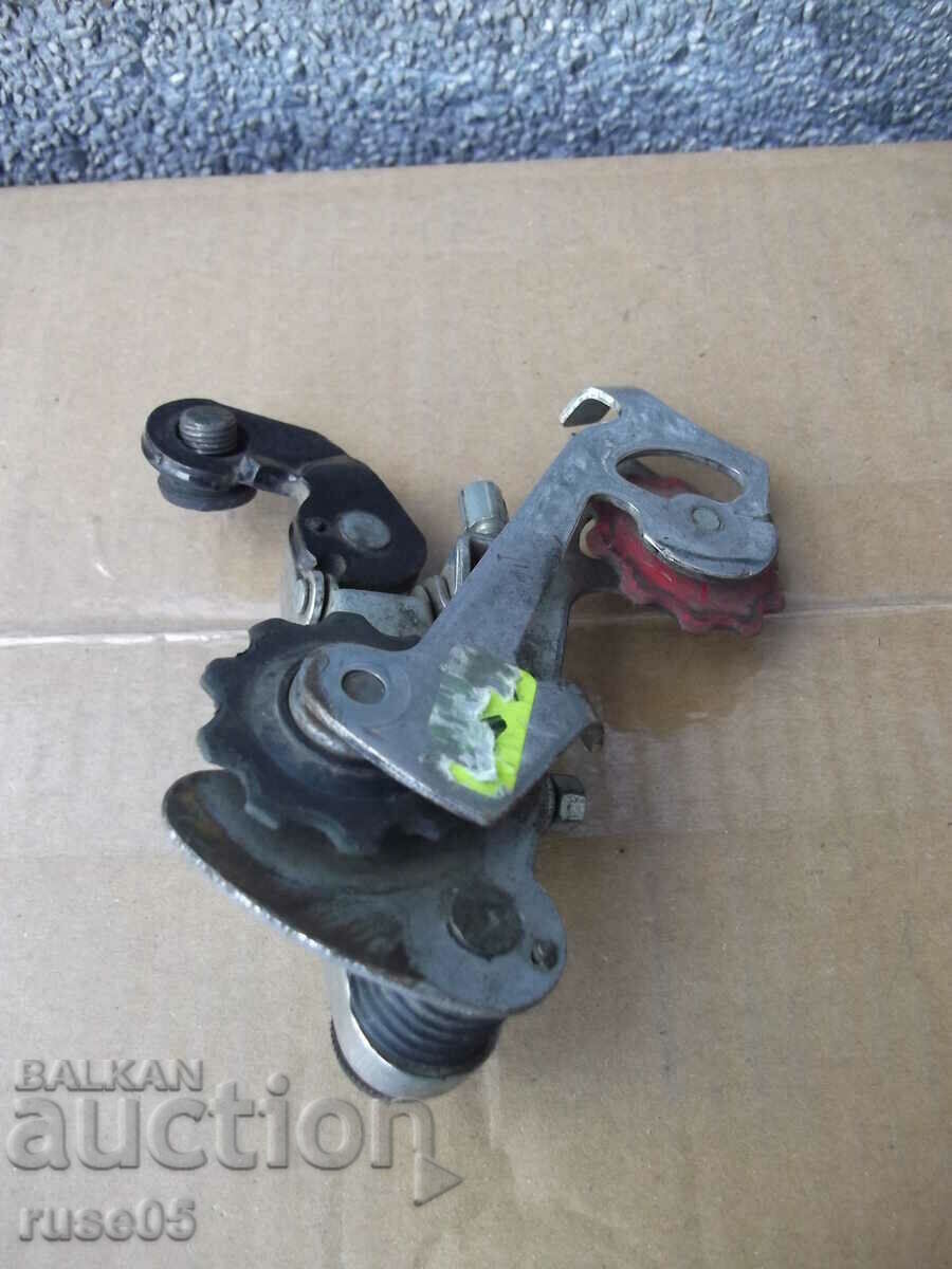 Rear derailleur (tensioner) on a bicycle chain - 6