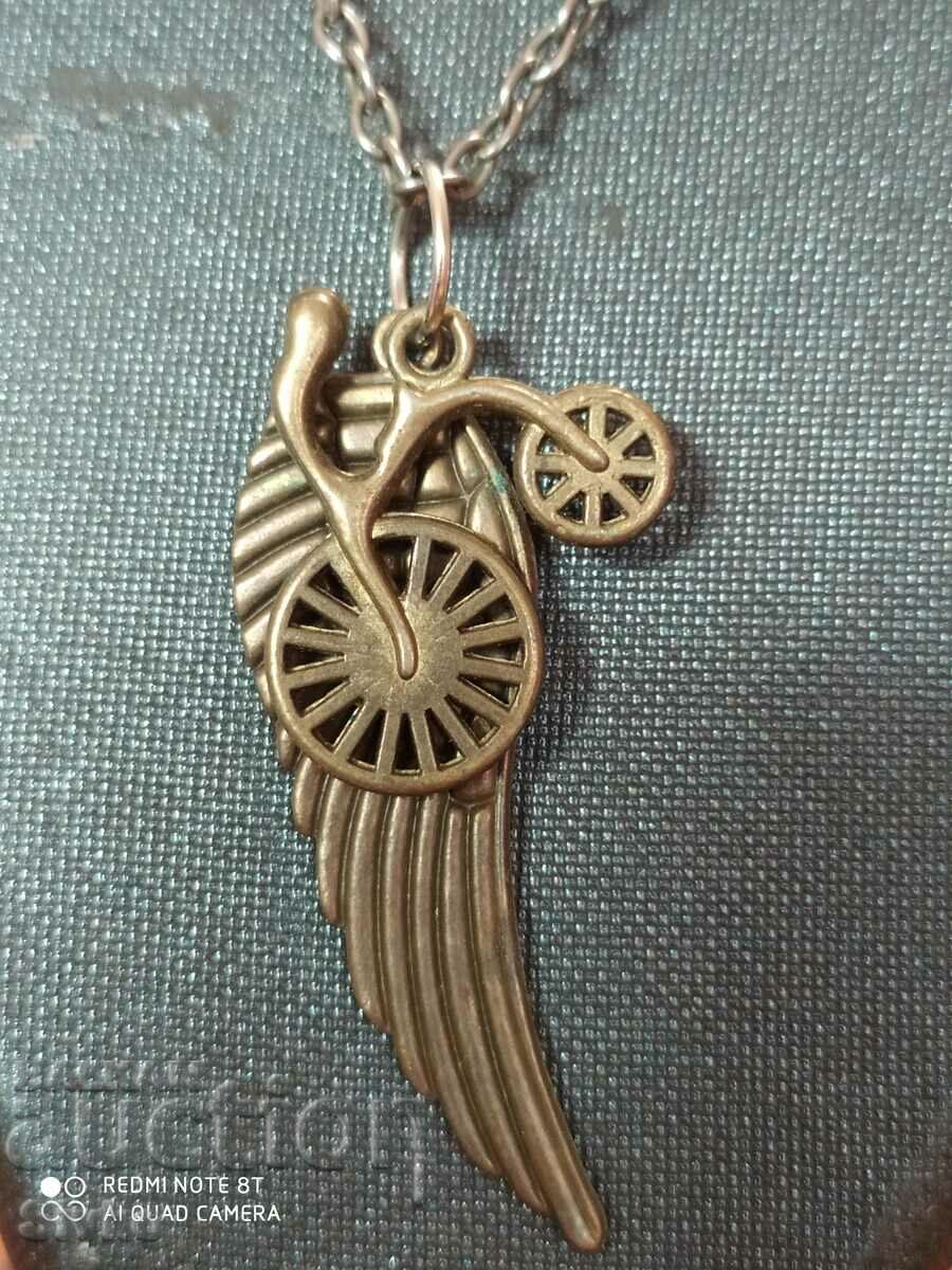 Wheel and wing necklace