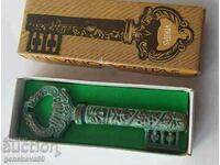 Antique corkscrew, bronze, patina, key in box