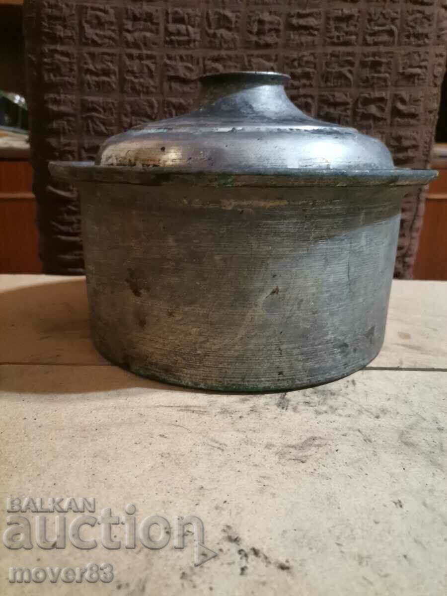 A copper pot.