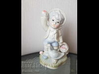 Porcelain figurine of a boy