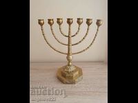 A massive Jewish bronze menorah candle holder