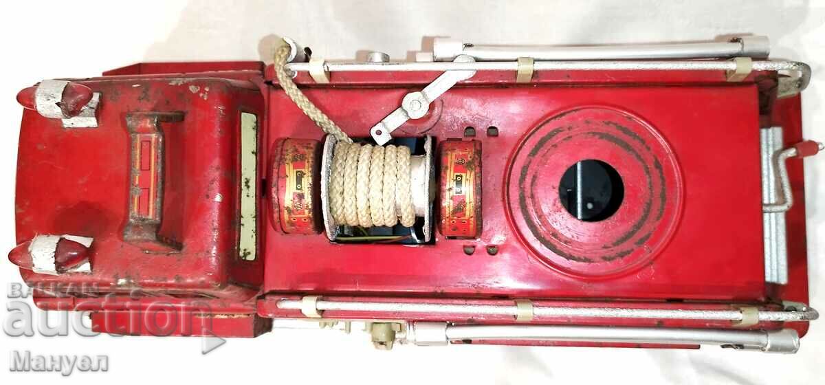 Delivery of Old tin toy - fire engine. Delivery of Old tin toy - fire engine.