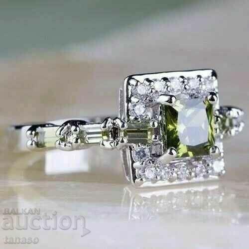 Ring with olivine and white zircons