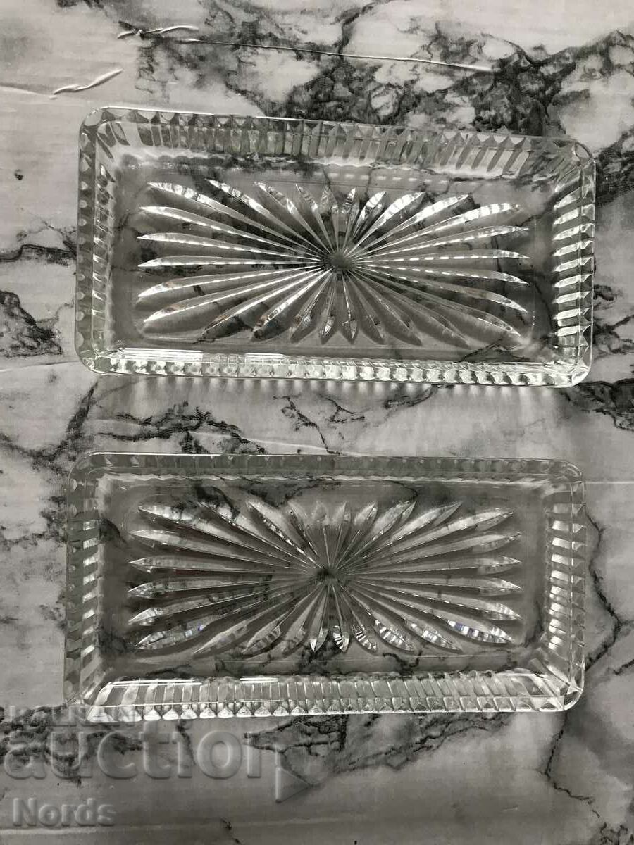 Two glass saucers