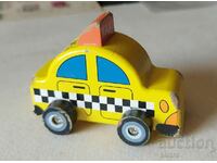 Wooden retro trolley - yellow cab. And