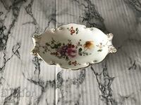 Small porcelain saucer with markings