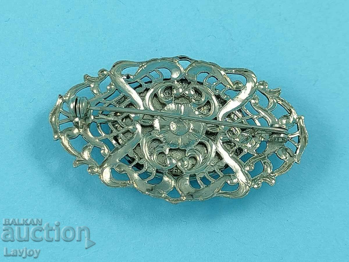 Delivery of Old openwork black stone brooch