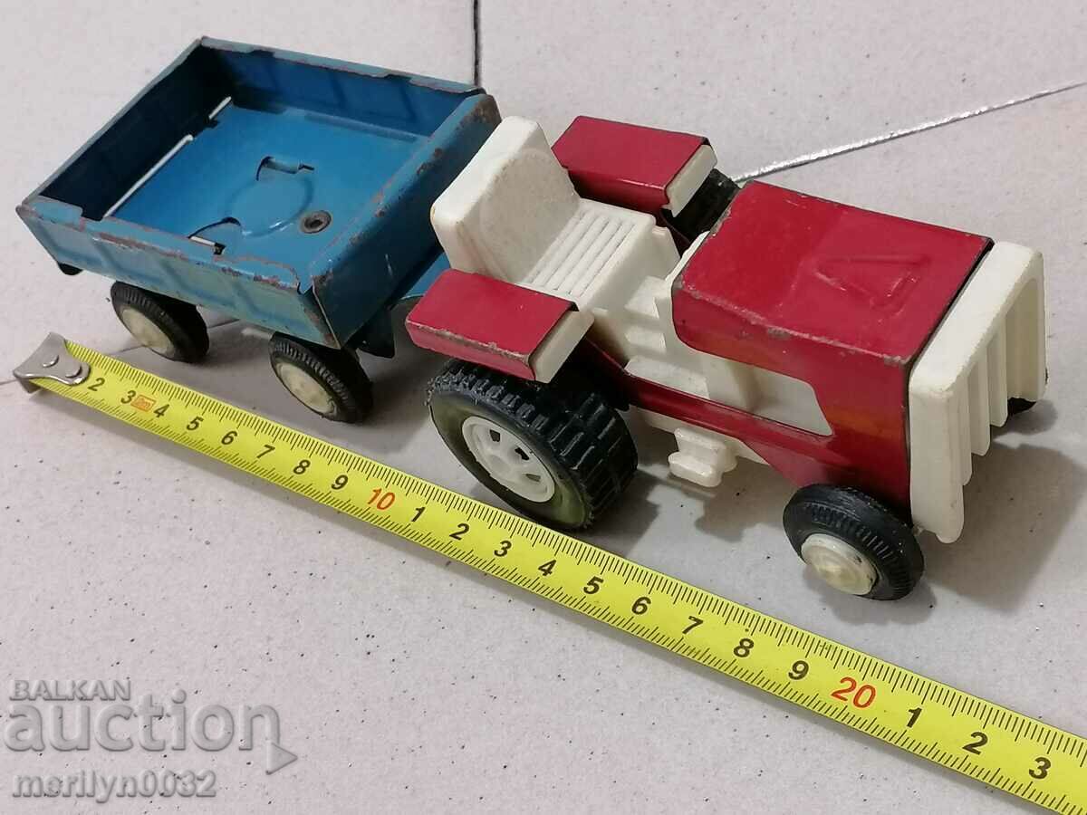 Children's tin toy tractor with trailer 70s NRB with price 48.00 BGN | € 24.54 Children's tin toy tractor with trailer 70s NRB with price 48.00 BGN | € 24.54