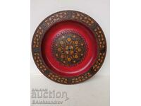 Wood carving plate with brass studs