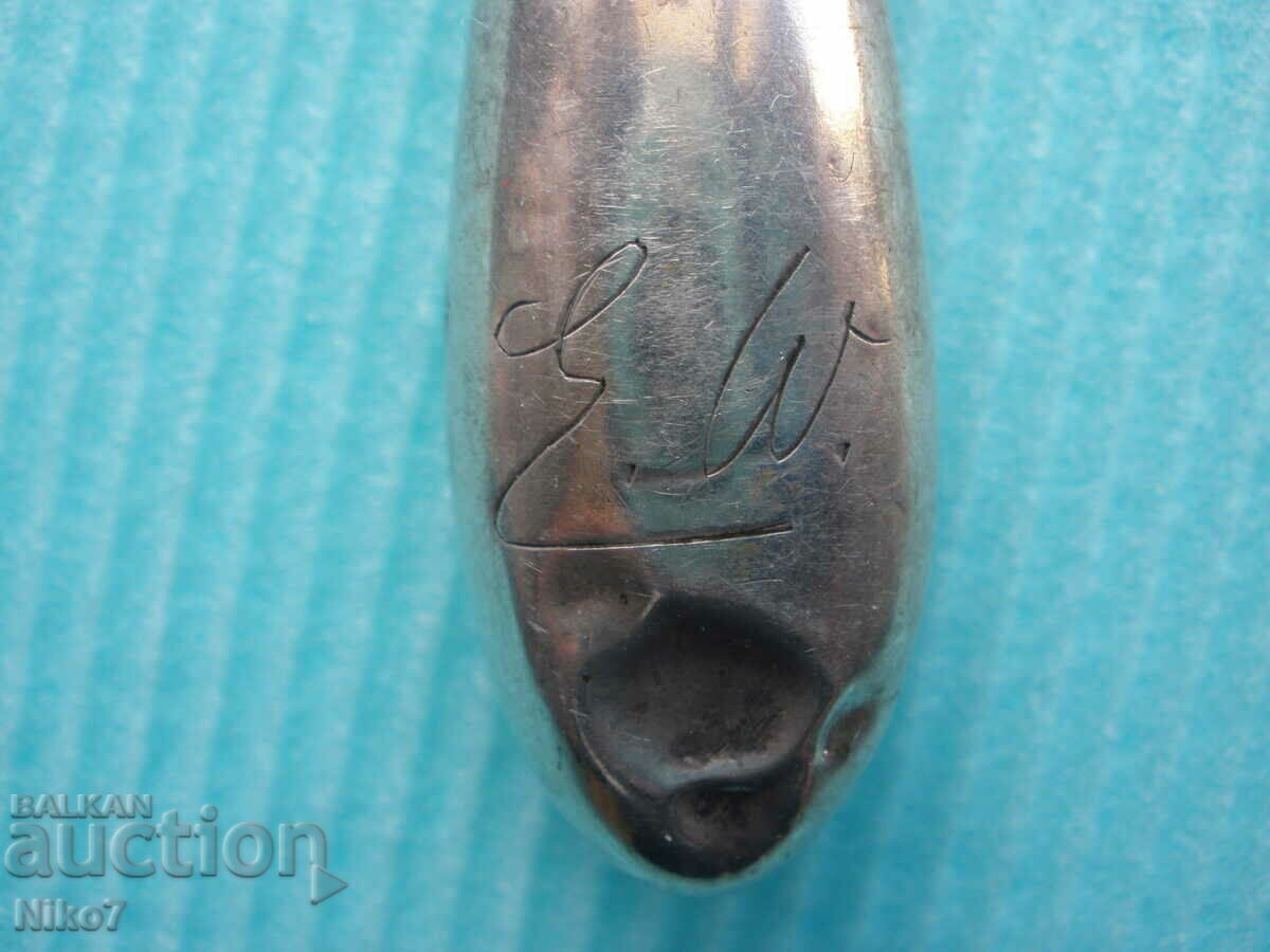 Delivery of Antique tweezers with a silver handle.