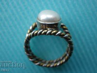 Old ring-pearl, silver and bronze.