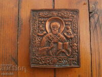 A small icon made of metal and wood