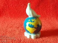 Old porcelain figure White Dove on Globe Globe