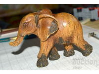Vintage hand carved elephant figurine - material resin...