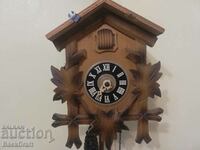 German wall clock with cuckoo, pendulum, weights