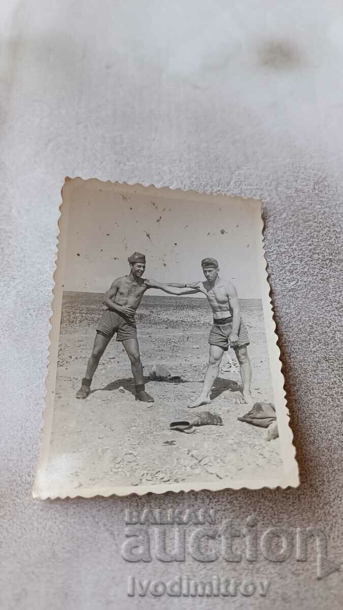 Photo Two soldiers naked to the waist