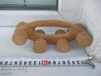 Wooden massager with wheels