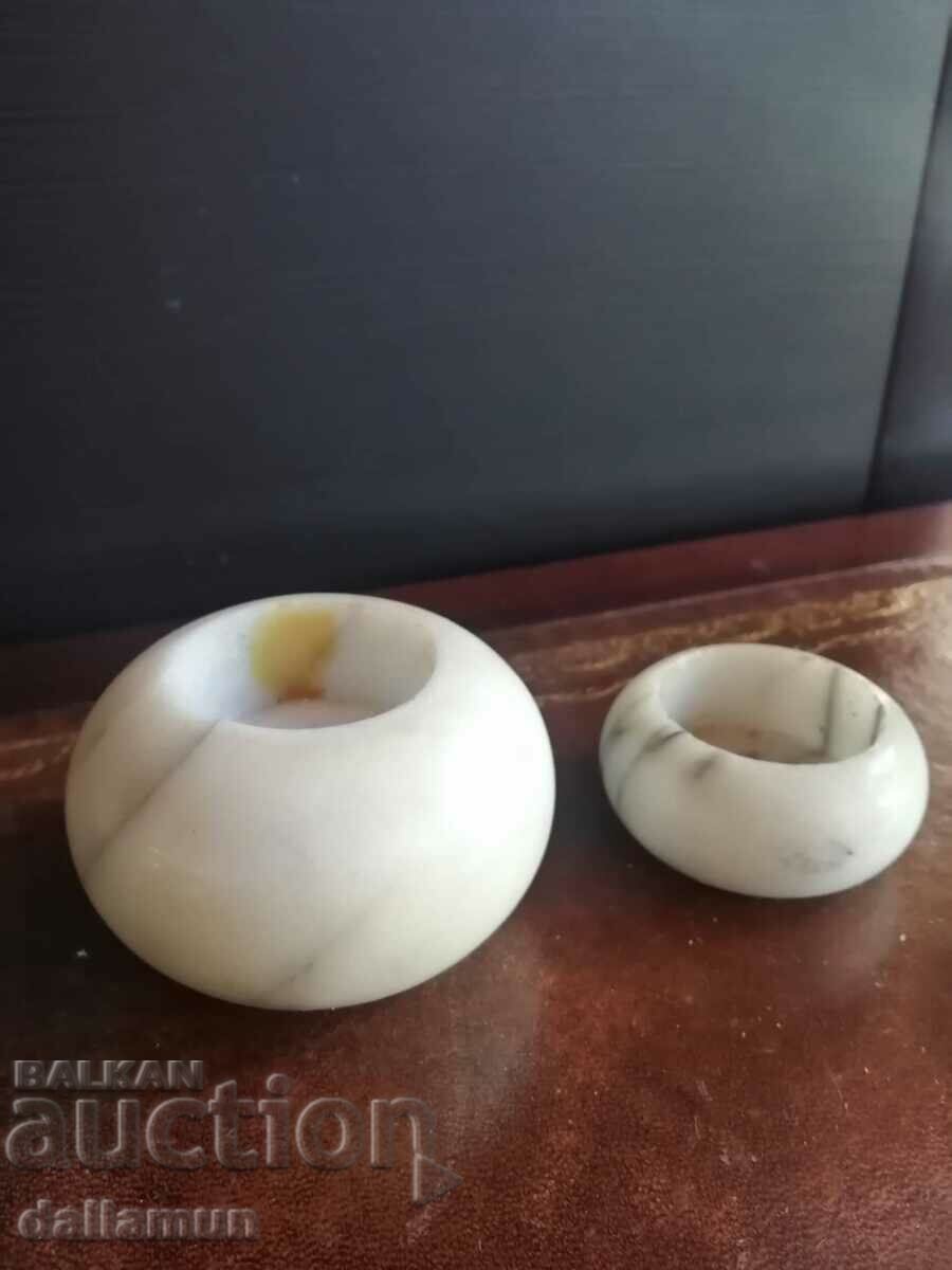a pair of marble candlesticks