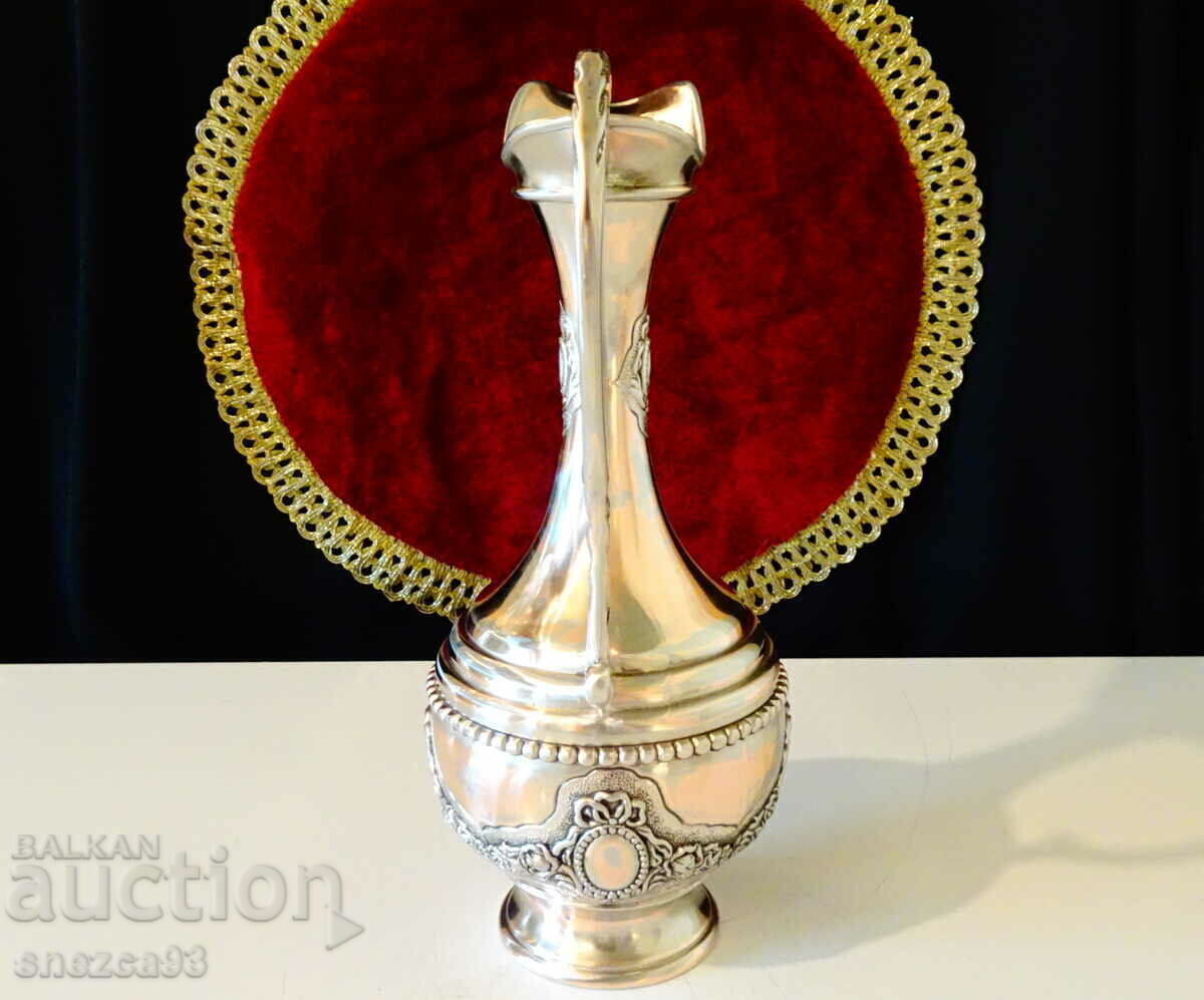 Delivery of Silver-plated copper jug, roses, ornaments. Delivery of Silver-plated copper jug, roses, ornaments.