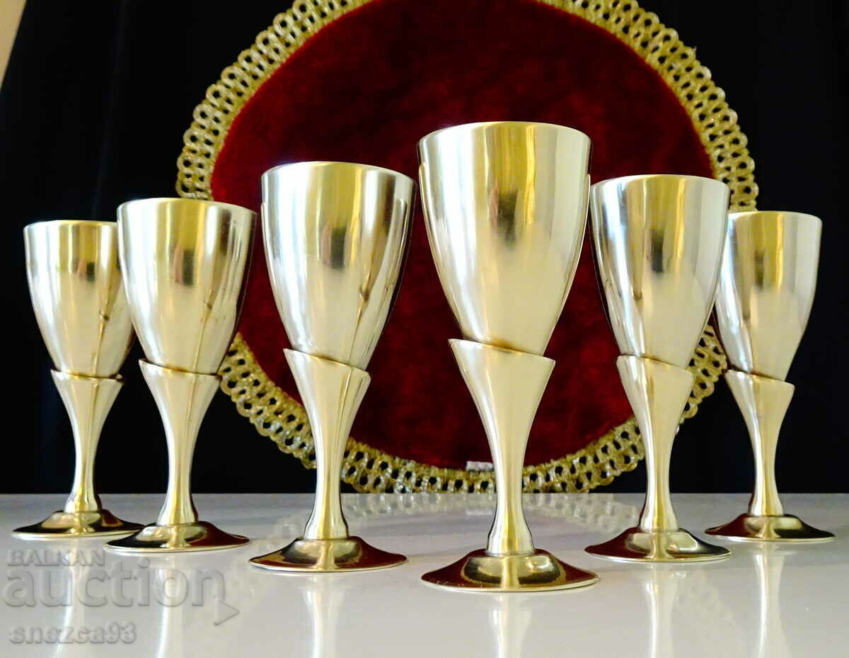 English bronze cups on a chair, tulip.