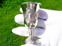 Silver-plated copper cup, roses, ornaments.