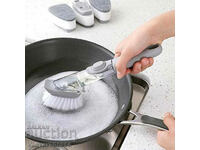Brush for washing dishes with detergent dispenser