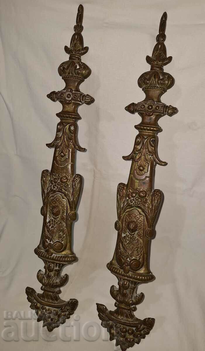 A pair of old bronze applique ornaments