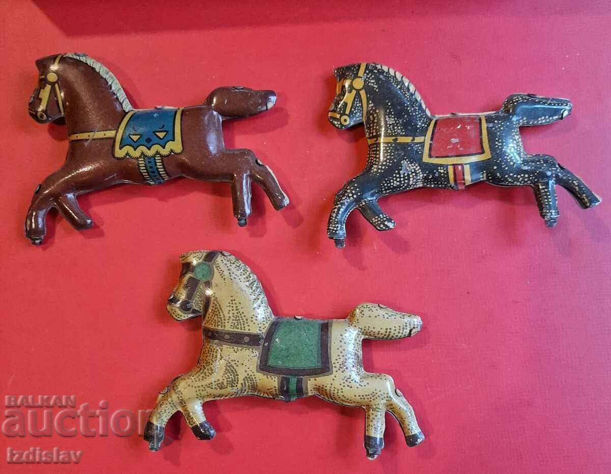 Old tin horses part of a carousel