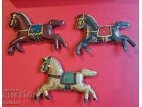 Old tin horses part of a carousel