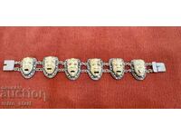 Silver bracelet with many faces