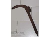 Old hand-forged scythe, wrought iron
