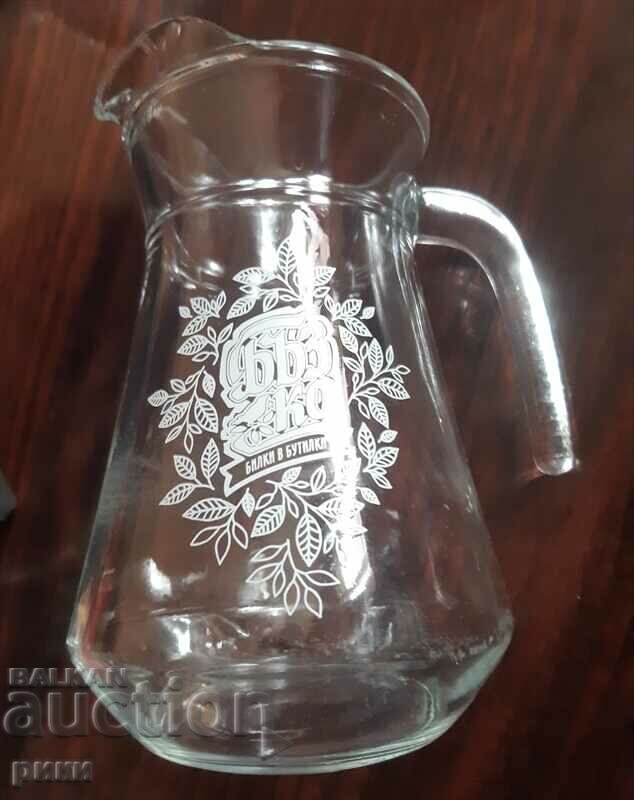Glass jug with inscription