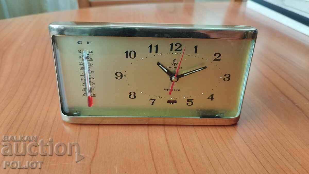 Old alarm clock with thermometer, China, 1980s.