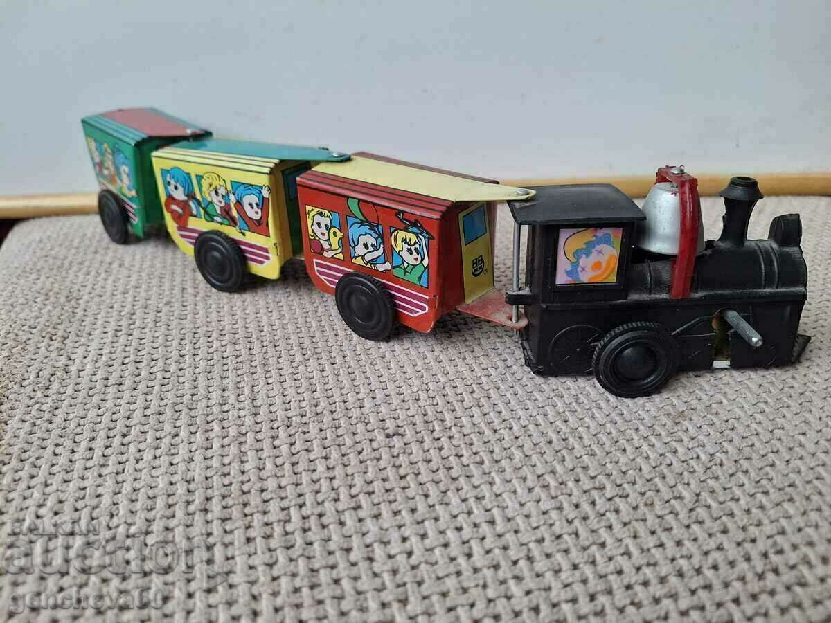 Auction Mechanical tinplate old train with a bell Auction Mechanical tinplate old train with a bell