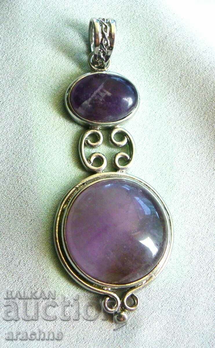 Very large silver locket with amethysts